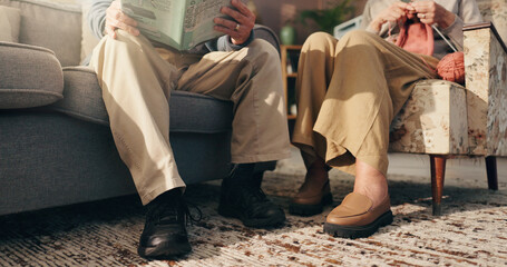 Old couple, read and knitting in living room, legs or elderly people with hobby and retirement home. House, feet and woman with needlework in lounge, reader and senior man with novel for knowledge