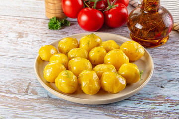 Boiled young potato with oil