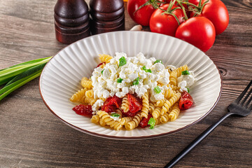 Italian pasta fusili with curd