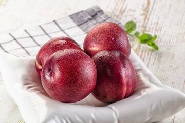 Ripe sweet juicy nectarines heap