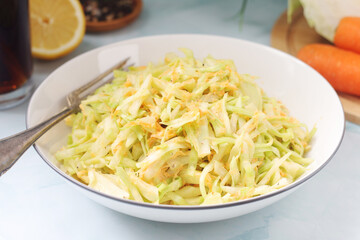 A bowl with coleslow salad	