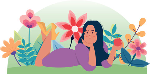 girl in summer dress lies on grass against background of summer flowers and smiling holds apple in hand