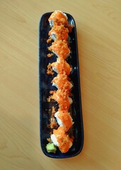 Crispy-Topped Sushi Roll on Rectangular Plate, Overhead View