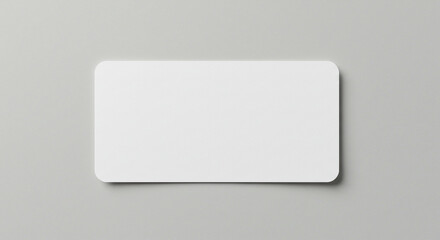 Blank white business card with rounded corners on gray
