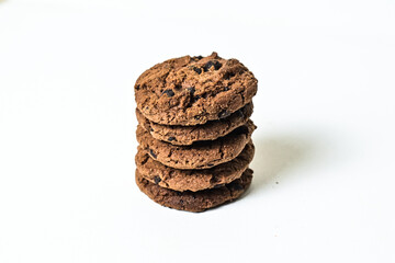 Pile or stack of chocolate chip cookies isolated on white background. Close up. clipping path.