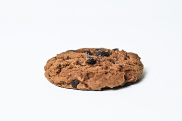Side view of one chocolate chip cookie isolated on white background. clipping path. close up.