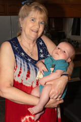 Grandmother Holding New Grandson, vertical