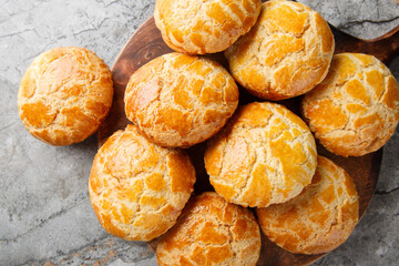Bolo bao are Chinese pineapple buns while they do not taste of pineapple, they do have a great texture and a sweet flavour closeup on the table. Horizontal top view from above