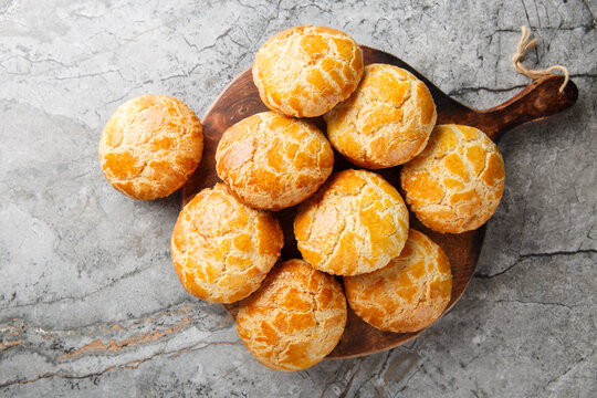 Chinese pineapple buns or bo lo bao they don&rsquo;t actually contain any pineapple, but get their names from their golden crusted tops closeup on the table. Horizontal top view from above