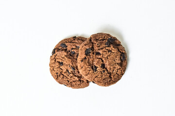 Top view of two chocolate chip cookies isolated on white background. Close up. clipping path. pile,...