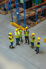 Top view of warehouse workers clapping their hands
