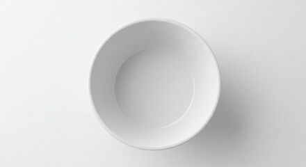 Empty white ceramic bowl on white background, overhead shot