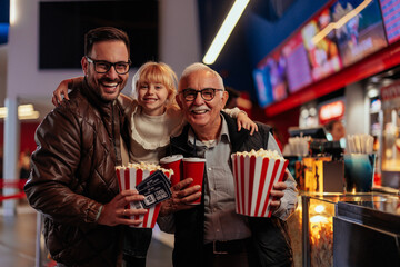 Happy multigeneration family at movies.
