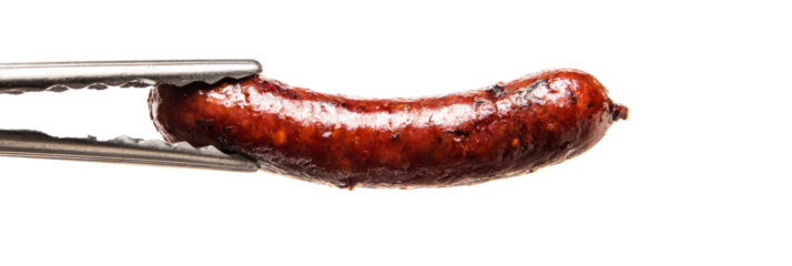 Sizzling sausage link held mid-air in tongs, glistening oil and browning, white background