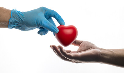 doctor hands  giving a red heart, health care, organ donation, family life insurance, world heart day, world health day, praying concept.