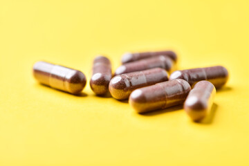 Lutein capsules. Dietary supplement on bright background. Soft focus. Close up. Copy space	
