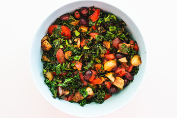 salad with air fried kale, tomatoes, potatoes, capers and olives