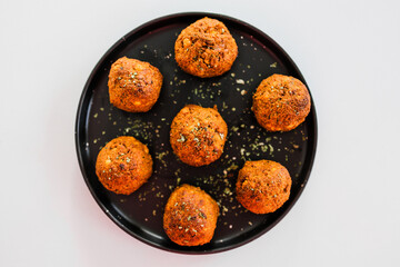 homemade chickpea falafels with paprika cumin and coriander on black plate