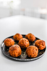 homemade chickpea falafels with paprika cumin and coriander on black plate