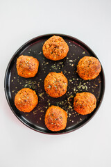 homemade chickpea falafels with paprika cumin and coriander on black plate