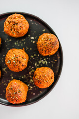 homemade chickpea falafels with paprika cumin and coriander on black plate