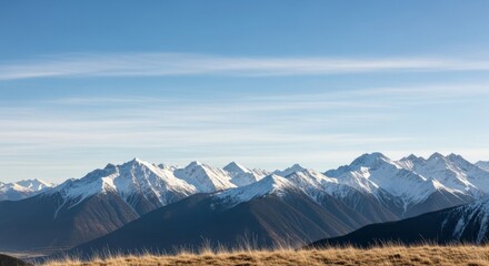 Fototapeta premium Majestic Snow-Capped Mountains Under a Clear Blue Sky Landscape.
