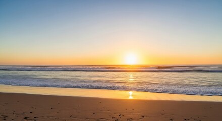 Golden Sunrise Reflecting on the Ocean Waves and Sandy Beach