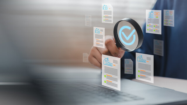 Businessperson inspecting digital property documents with magnifying glass icon and checklist interface on laptop screen. Concept for real estate approval, smart review, or financial auditing system.