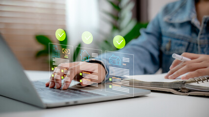 Close-up of a businessperson managing real estate data and digital property documents on laptop with checklist interface. Concept of smart property investment, mortgage approval, and digital workflow. © FAMILY STOCK