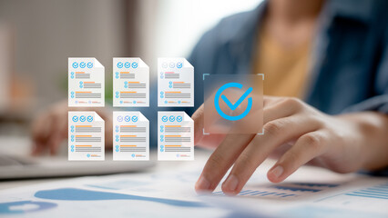 Hand touching digital checklist icon on screen, task completion concept, project management,...