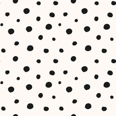 Abstract black polka dot pattern on a light background. Minimalist and versatile design.