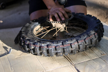 Selective Focus: New motocross tires are being changed by the motocross repair elephant.