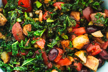 salad with air fried kale, tomatoes, potatoes, capers and olives
