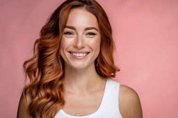 Cheerful Casual Woman Proud of Her Smile in Studio Shot