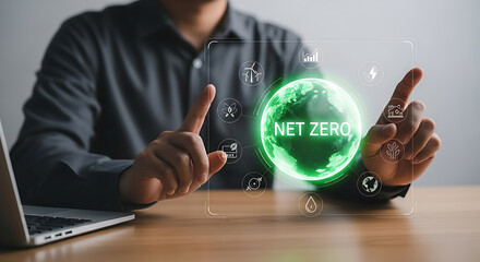 Businessman interacting with net zero icon representing environmental sustainability and clean energy initiatives