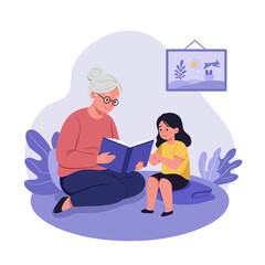 Grandmother reading a book to her granddaughter spending quality time together indoors