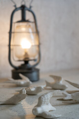 Cafe interior adorned with white handmade doves and glowing lanterns for ambiance