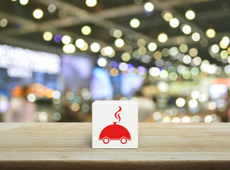 Restaurant cloche flat icon on white block cube on wooden table over blur light and shadow of shopping mall, Business food delivery online concept
