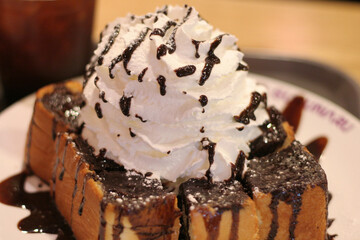 Honey Bread with Whipped Cream and Chocolate Drizzle – Cafe Dessert Close-Up