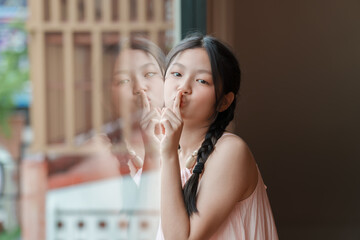 Teenage girl silencing her thoughts cozy room portrait calm atmosphere introspective viewpoint