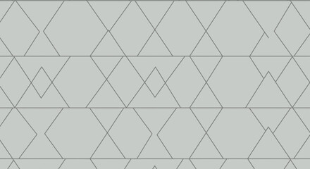 Fototapeta premium Elegant geometric pattern with diamond and triangle shapes on a gray background