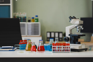 Science lab workspace with test tubes and equipment, research in action.