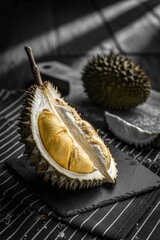 Obraz premium Fresh Durian Fruit Opened Showing Yellow Flesh Close-up.