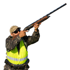 Silhouette of a hunter with a gun in the reeds against the sun, an ambush for ducks with dogs