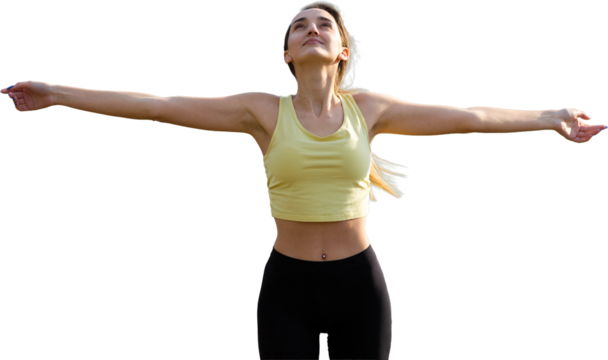 A young slim athletic girl in sportswear performs a set of exercises. Fitness and healthy lifestyle  against the background of green spring pasture hills.