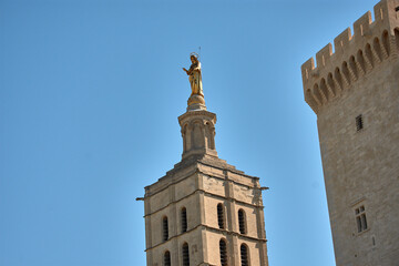 The golden sculpture of the Virgin Mary on the bell tower of the Popes' Palace, Avignon, Provence,...