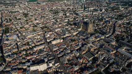 An Aerial panorama view with pan of the old town around the city Reims in France on a sunny spring...