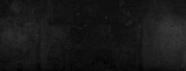 Black cement texture with gradient color with soft light. Wide and large backdrop.