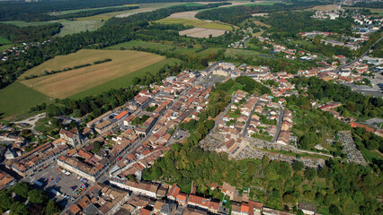 An Aerial panorama view with pan of the old town around the city Sainte-Menehould in France on a...