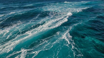 Ocean, sea, water, waves, and foam form a stunning pattern of pure blue and turquoise textures, revealing nature’s vibrant rhythm, sparkling movement, and fluid energy in a vivid aquatic display.

